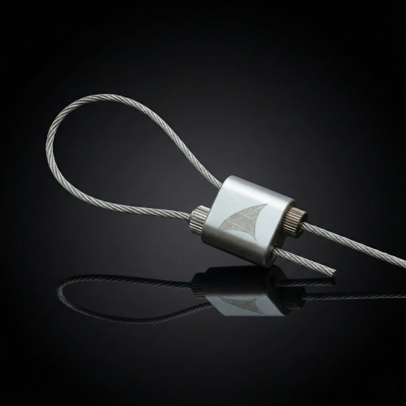 AWG-GRIP adjustable wire joiner, silver barrel with two set screws and engraved AWG logo, wire rope looped through, on black studio background.